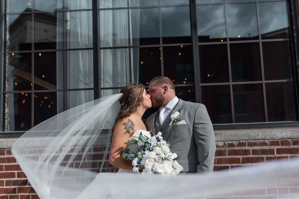 Bride and groom sharing a moment outside INDUSTRY wedding venue in Indianapolis IN