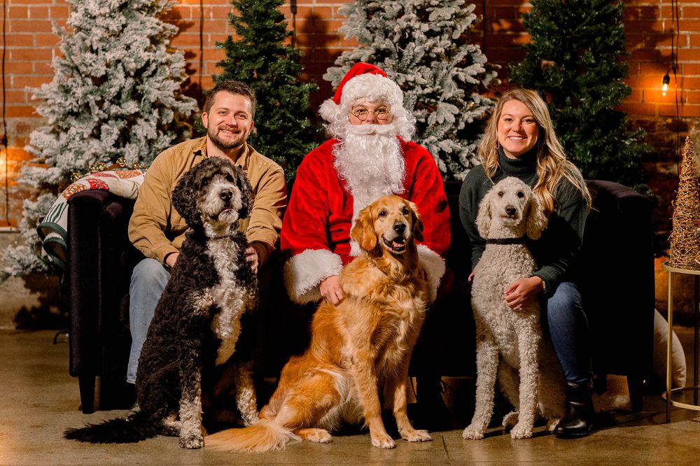 Holiday family photos with santa and pets