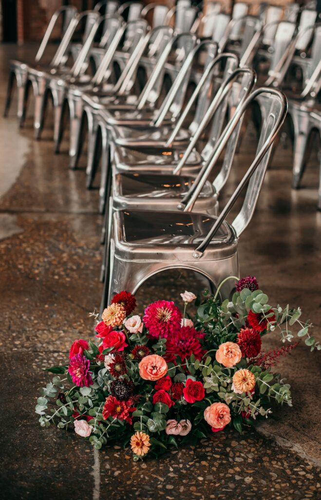 Wedding ceremony chairs and florals