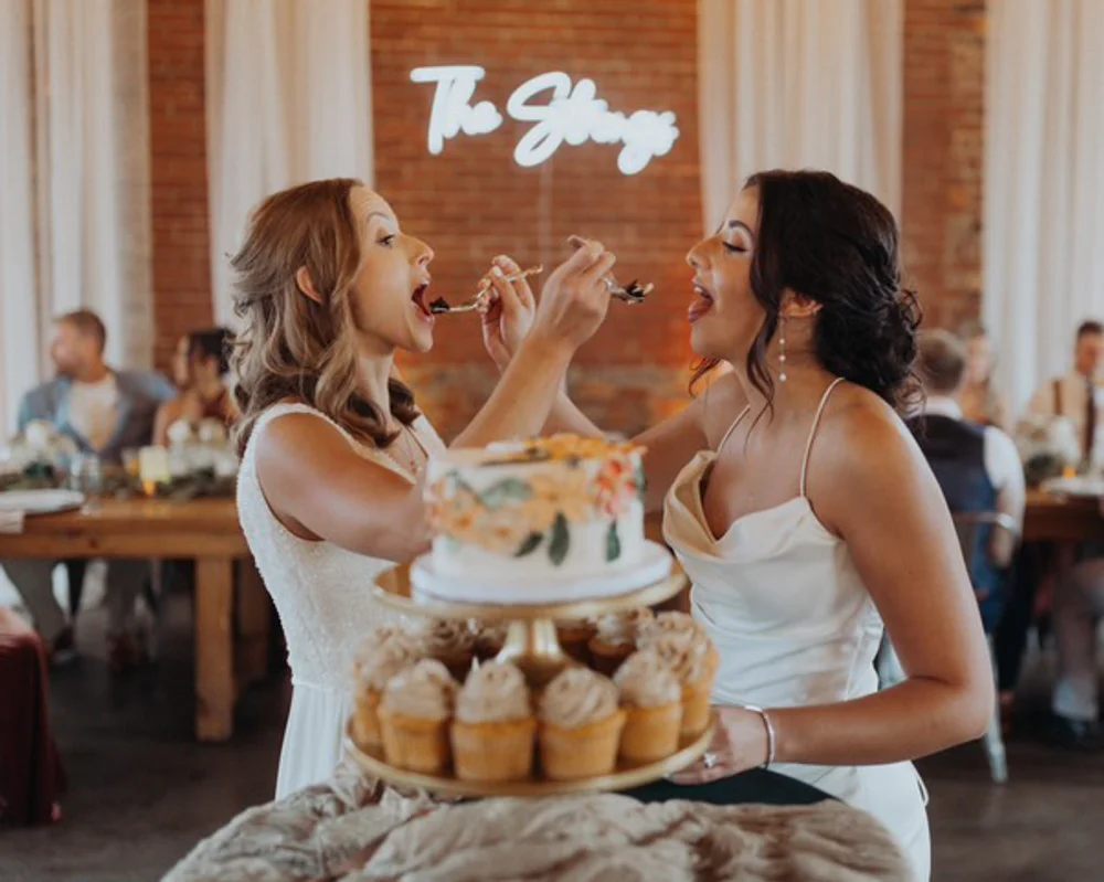 Brides doing a cake cutting ceremony
