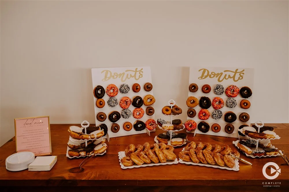 Donut display for dessert at a wedding at INDUSTRY