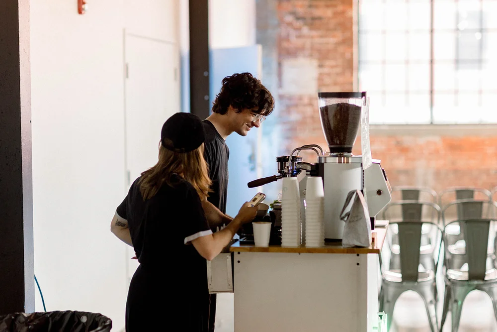 People making coffee at coffee cart at INDUSTRY in Indianapolis