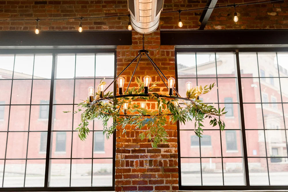 Chandelier with greenery at INDUSTRY in Indianapolis