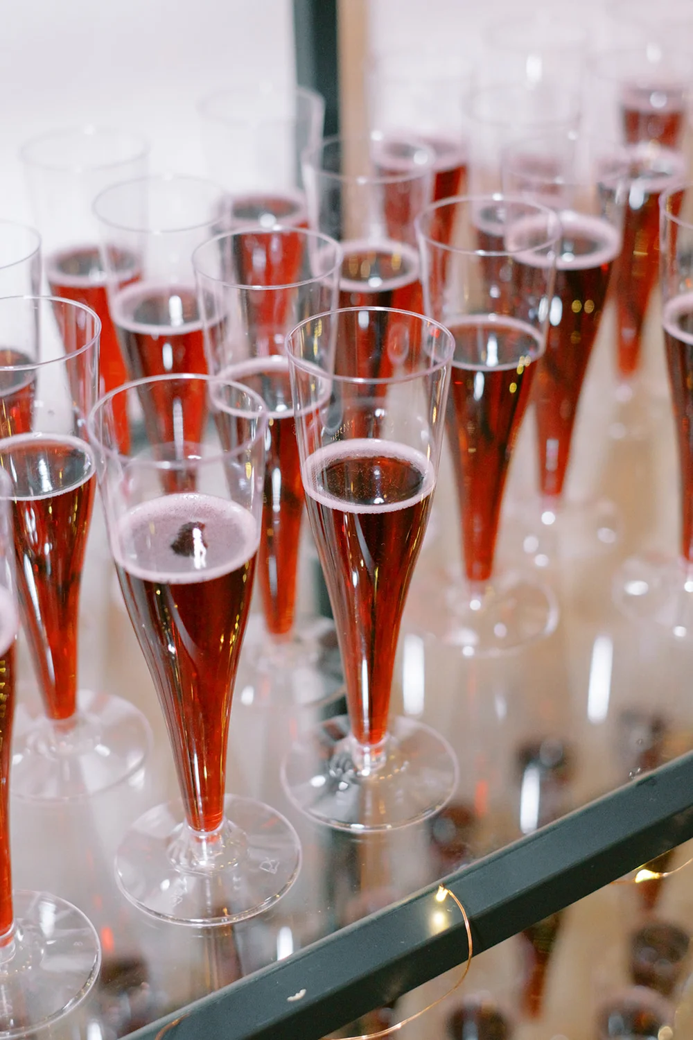 Red champagne setup on a shelf at Indianapolis corporate holiday party