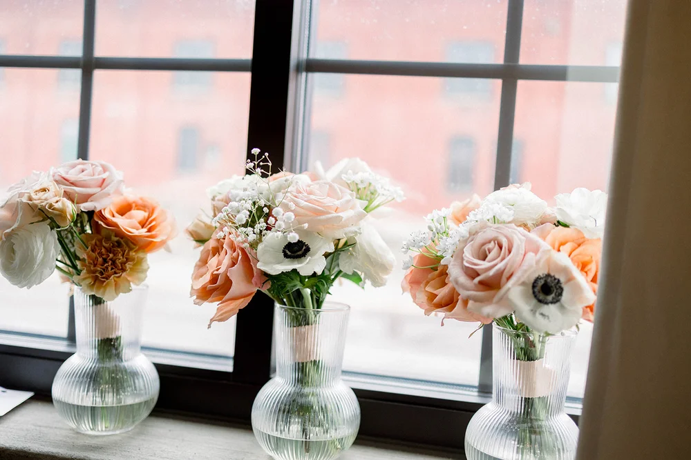 Floral wedding bouquets arranged on a windowsill, perfect for Indianapolis wedding inspiration