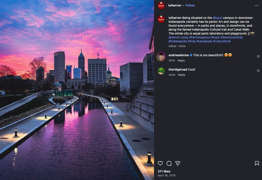 Photo showcasing the Indianapolis Canal with skyline and reflective water views