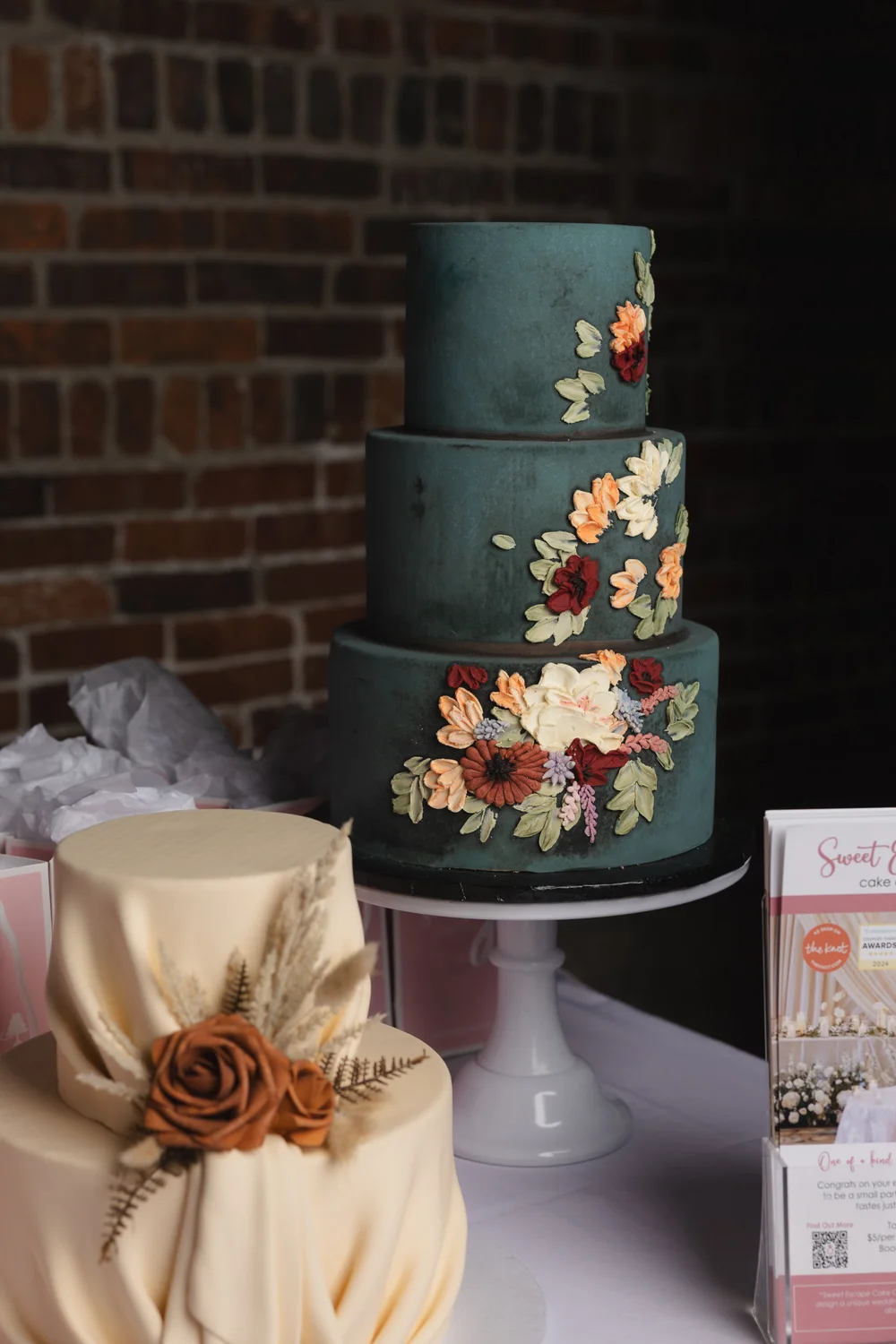Three-tier blue wedding cake with buttercream flowers by Sweet Escape Cake Co Indianapolis